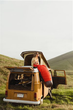 Young male skateboarder looking out from top of vintage recreational vehicle, Exeter, California, USA Stock Photo - Premium Royalty-Free, Code: 614-09026454