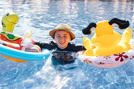 Portrait of boy in outdoor swimming pool Stock Photo - Premium Royalty-Free, Code: 614-09038632