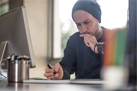 simsearch:614-06896117,k - Young male designer contemplating at home desk Stock Photo - Premium Royalty-Free, Code: 614-09038951