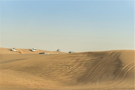 dune driving - Off road vehicles driving on desert dunes, Dubai, United Arab Emirates Stock Photo - Premium Royalty-Free, Code: 614-09056568