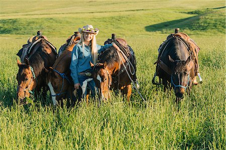 Teenage girl with four horses, Enterprise, Oregon, United States, North America Stock Photo - Premium Royalty-Free, Code: 614-09056865