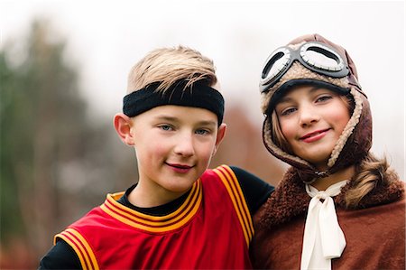 simsearch:614-03469543,k - Portrait of boy and twin sister wearing basketball and pilot costumes for halloween Stock Photo - Premium Royalty-Free, Code: 614-09057089