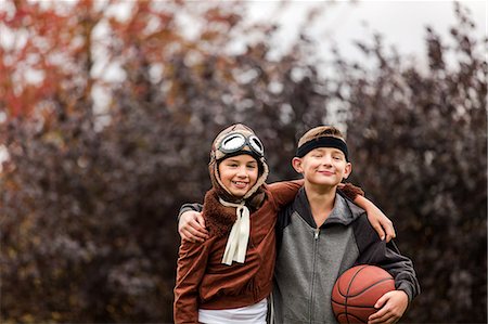 simsearch:614-03469543,k - Portrait of girl and twin brother wearing basketball player and pilot costumes for halloween in park Stock Photo - Premium Royalty-Free, Code: 614-09057083