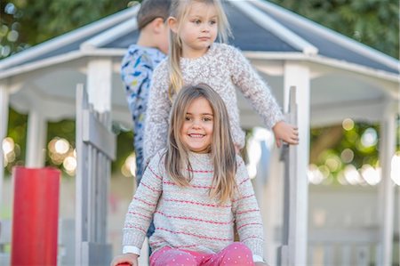 simsearch:614-07806393,k - Girls and boy at preschool, portrait at top of playground slide in garden Stock Photo - Premium Royalty-Free, Code: 614-09057256