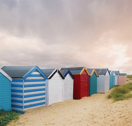 Row of colourful beach huts and storm clouds, Southwold, Suffolk, England Stock Photo - Premium Royalty-Free, Code: 614-09057425