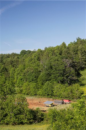 Field landscape of chicken coops on free range organic farm Stock Photo - Premium Royalty-Free, Code: 614-09057475