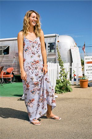 simsearch:614-09078761,k - Young woman in maxi dress laughing by airstream coffee shop Stock Photo - Premium Royalty-Free, Code: 614-09078766