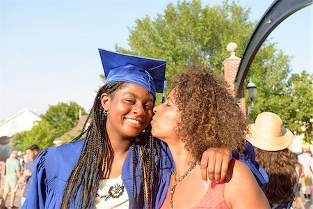 simsearch:693-06014177,k - Mother kissing daughter on cheek at graduation ceremony Stock Photo - Premium Royalty-Free, Code: 614-09078819