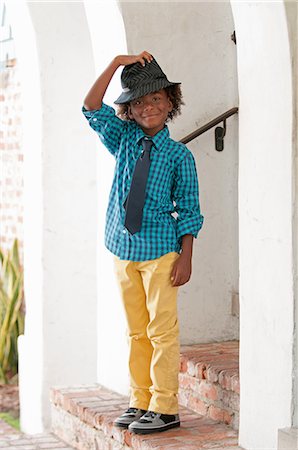 simsearch:614-06116419,k - Portrait of young boy, standing outdoors, wearing fedora Stock Photo - Premium Royalty-Free, Code: 614-09147678