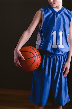 sports jersey - Boy holding basketball Stock Photo - Premium Royalty-Free, Code: 614-09147700