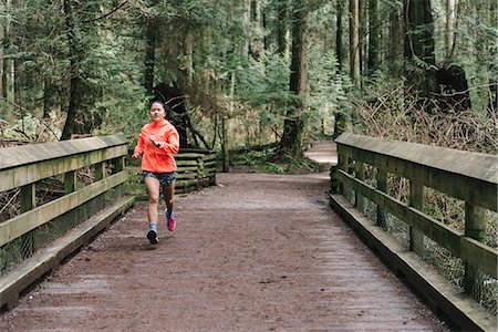 simsearch:649-07437947,k - Woman running in forest, Vancouver, Canada Stock Photo - Premium Royalty-Free, Code: 614-09147805