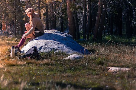 simsearch:614-09078761,k - Young female hiker sitting on rock taking a break in Tuolumne Meadows, upper part of the Yosemite National Park, California, USA Stock Photo - Premium Royalty-Free, Code: 614-09168112
