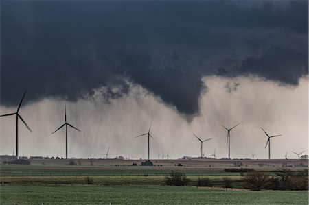 Tornado (with no visible contact over ground) behind wind farm over rural Kansas, US Stock Photo - Premium Royalty-Free, Code: 614-09168126
