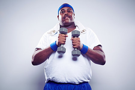 fat man exercising - Mature man using hand weights Stock Photo - Premium Royalty-Free, Code: 614-09209952