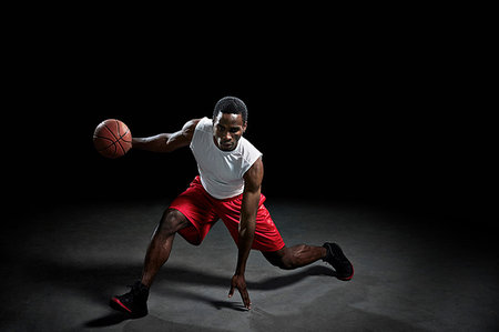 simsearch:614-06624830,k - Studio shot of basketball player with ball Stock Photo - Premium Royalty-Free, Code: 614-09210337