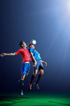 simsearch:614-07239995,k - Male soccer players heading ball Stock Photo - Premium Royalty-Free, Code: 614-09210343