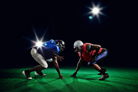simsearch:6113-08698170,k - Two american footballers crouching Stock Photo - Premium Royalty-Free, Code: 614-09210356