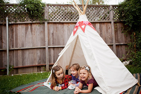 simsearch:649-07761212,k - Three young girls lying in teepee in garden Stock Photo - Premium Royalty-Free, Code: 614-09210678