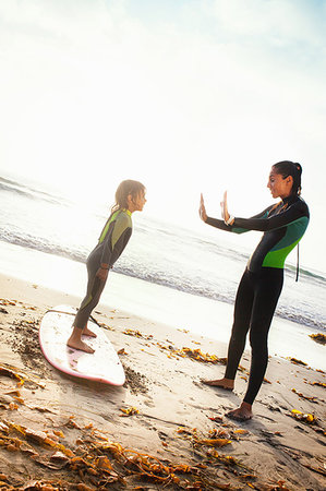 simsearch:614-07735242,k - Mother and daughter practicing on surfboard, Encinitas, California, USA Stock Photo - Premium Royalty-Free, Code: 614-09210688