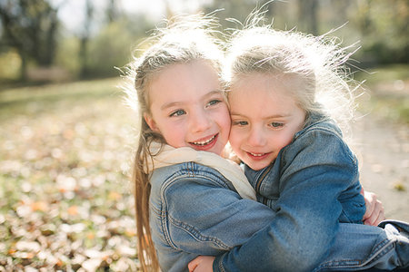 simsearch:649-08004031,k - Sisters hugging in forest Stock Photo - Premium Royalty-Free, Code: 614-09231977