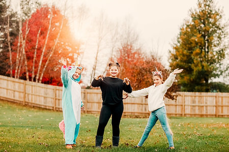 fence painting - Girls in halloween costume posing in park Stock Photo - Premium Royalty-Free, Code: 614-09232208