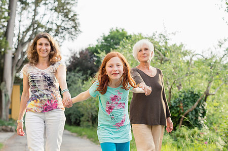 simsearch:614-07735242,k - Girl on rural road holding hands with mother and grandmother, portrait Stock Photo - Premium Royalty-Free, Code: 614-09245257