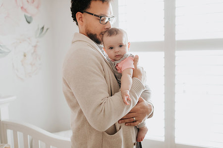 simsearch:6113-07543205,k - Father with baby daughter in baby's room Stock Photo - Premium Royalty-Free, Code: 614-09249545