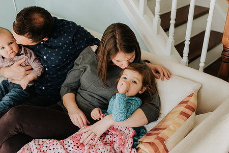 simsearch:649-07437107,k - Mid adult couple on sofa with baby son and toddler daughter Stock Photo - Premium Royalty-Free, Code: 614-09249644