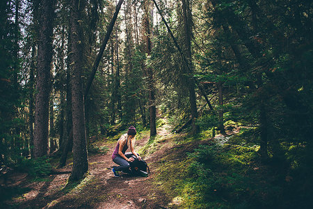 simsearch:649-08086253,k - Hiker checking backpack in forest, Johnston Canyon trail, Banff, Canada Stock Photo - Premium Royalty-Free, Code: 614-09249818