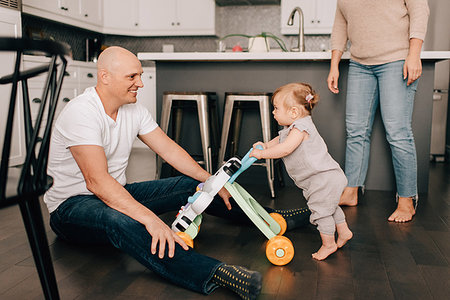 dad shave - Mother father playing with baby daughter in kitchen Stock Photo - Premium Royalty-Free, Code: 614-09258602