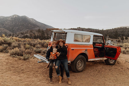 Couple with baby girl by offroad vehicle, Kennedy Meadows, California, US Stock Photo - Premium Royalty-Free, Code: 614-09259151