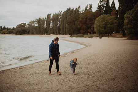 simsearch:614-07735242,k - Mother and baby walking on beach, Wanaka, Taranaki, New Zealand Stock Photo - Premium Royalty-Free, Code: 614-09259189