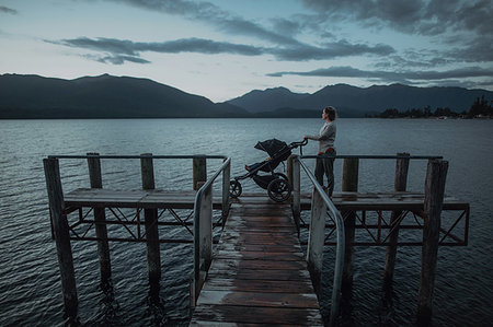 simsearch:614-07735242,k - Mother with baby in pram on bridge by seaside, Te Anau, Southland, New Zealand Stock Photo - Premium Royalty-Free, Code: 614-09259234