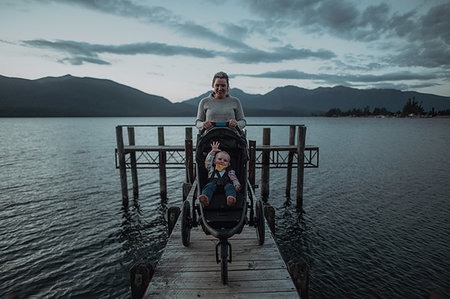 simsearch:614-07735242,k - Mother with baby in pram on bridge by seaside, Te Anau, Southland, New Zealand Stock Photo - Premium Royalty-Free, Code: 614-09259235