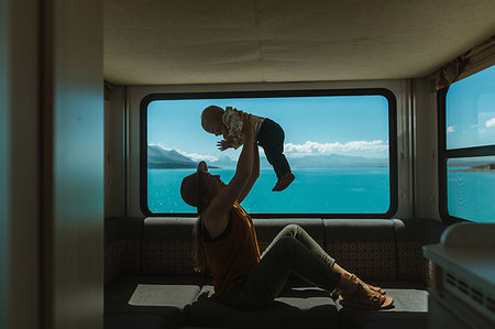 simsearch:614-07735242,k - Mother playing with baby in motorhome, Wanaka, Taranaki, New Zealand Stock Photo - Premium Royalty-Free, Code: 614-09259231