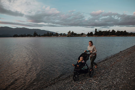 simsearch:614-07735242,k - Mother with baby in pram walking on beach, Te Anau, Southland, New Zealand Stock Photo - Premium Royalty-Free, Code: 614-09259233