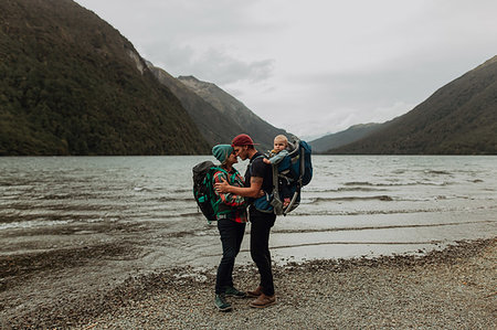simsearch:614-07735242,k - Parents with baby kissing on beach, Queenstown, Canterbury, New Zealand Stock Photo - Premium Royalty-Free, Code: 614-09259253