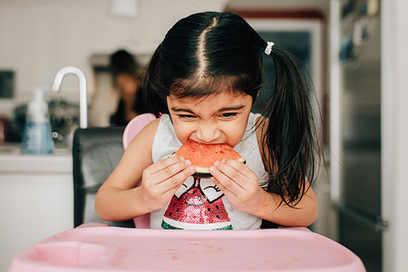 simsearch:614-07806265,k - Girl in high chair eating water melon Stock Photo - Premium Royalty-Free, Code: 614-09253678