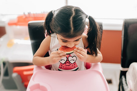simsearch:614-07806265,k - Girl in high chair eating water melon Stock Photo - Premium Royalty-Free, Code: 614-09253673