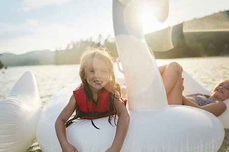 simsearch:649-07596731,k - Girls playing on inflatable swan in lake Stock Photo - Premium Royalty-Free, Code: 614-09253713