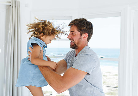 simsearch:614-08030822,k - Father playing and swinging daughter in beach house Stock Photo - Premium Royalty-Free, Code: 614-09276853