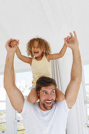 simsearch:649-07647801,k - Father giving daughter piggyback ride in beach house Stock Photo - Premium Royalty-Free, Code: 614-09276864