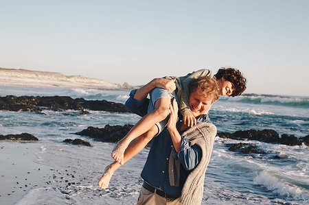 simsearch:649-07596731,k - Father carrying son over shoulder on beach Stock Photo - Premium Royalty-Free, Code: 614-09276958