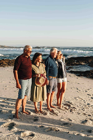 simsearch:614-08030822,k - Senior couples enjoying sun on sandy beach Stock Photo - Premium Royalty-Free, Code: 614-09276951