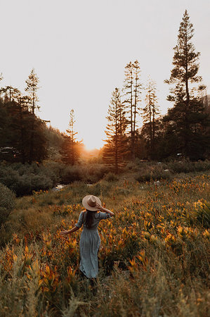 simsearch:614-09078761,k - Young woman in maxi dress and stetson watching sunset in rural valley, rear view, Mineral King, California, USA Stock Photo - Premium Royalty-Free, Code: 614-09270485