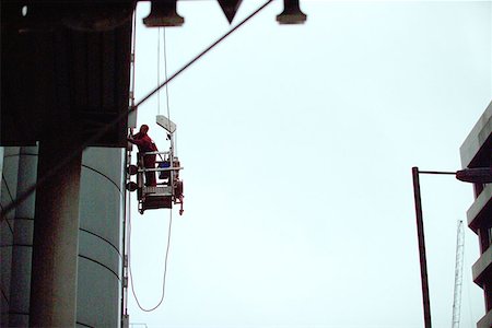 Window cleaning on skyscraper Stock Photo - Premium Royalty-Free, Code: 614-00383229