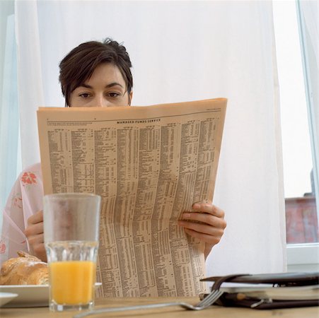 simsearch:6108-06166047,k - Woman with paper at breakfast Stock Photo - Premium Royalty-Free, Code: 614-00594483
