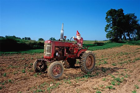 dwarf - Gnome on a tractor Stock Photo - Premium Royalty-Free, Code: 614-00656872