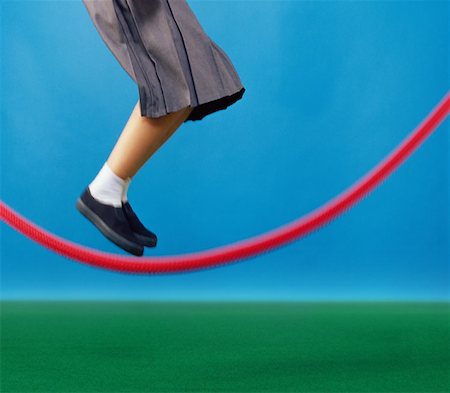 simsearch:614-00657328,k - Girl jumping over skipping rope Stock Photo - Premium Royalty-Free, Code: 614-00658828
