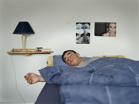 Teenage boy sleeping Stock Photo - Premium Royalty-Free, Code: 614-00653399